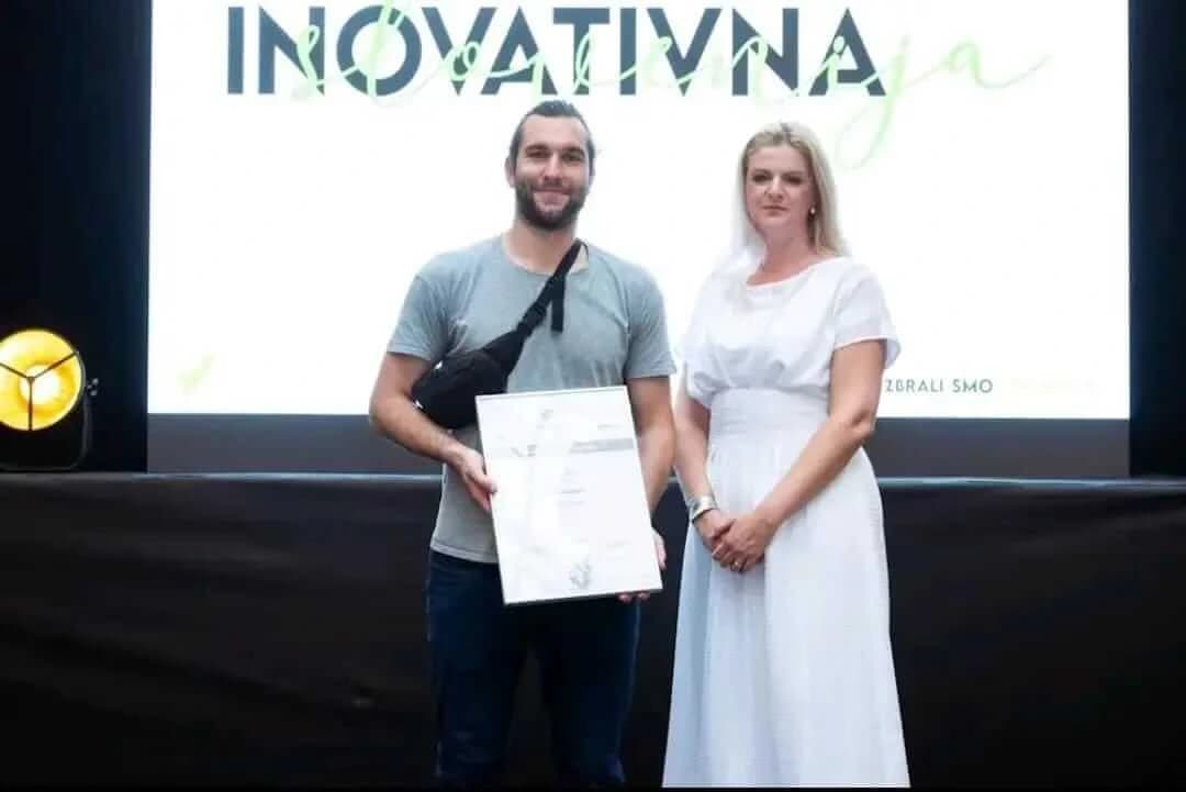 DDD Invoices team member receiving silver innovation award for e-invoicing.