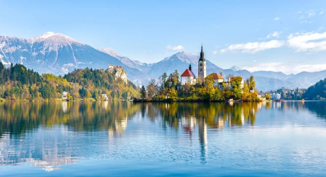 Slovenia fiscalization and e-invoicing by DDD Invoices, featuring Lake Bled with its iconic island church and alpine landscape, symbolizing compliant real-time VAT reporting and digital tax systems.