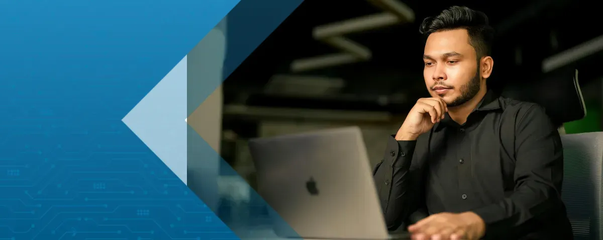 Finance manager at desk processing invoices