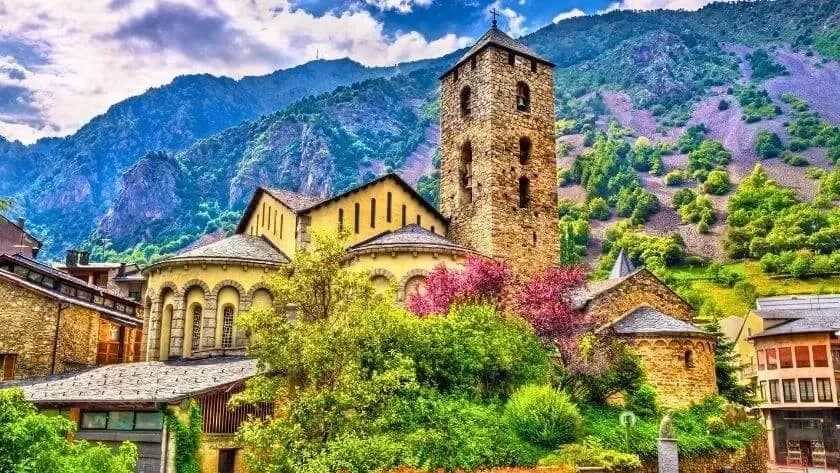 DDD Invoices supporting fiscalisation in Andorra, with a historic stone church and tower set against scenic mountain landscapes.
