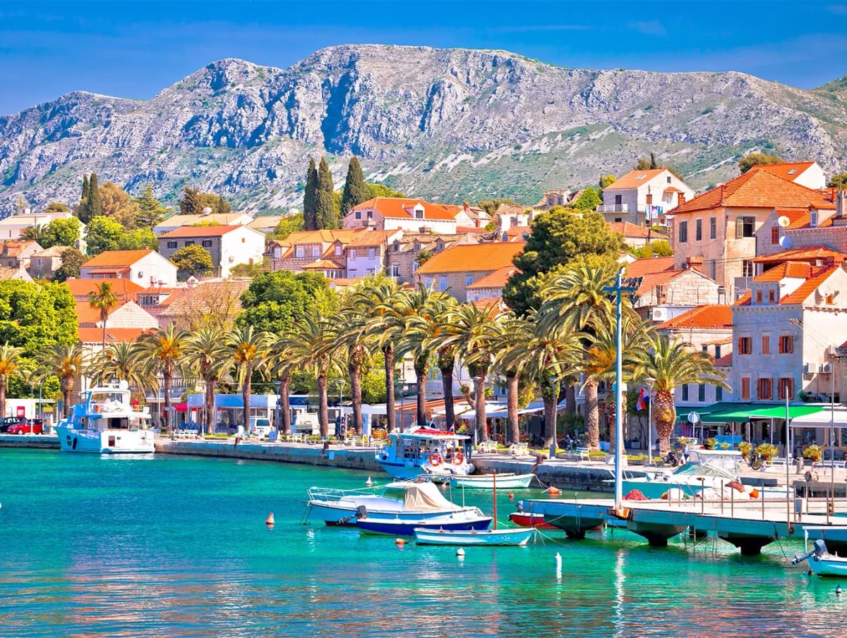 Panoramic view of Croatia's scenic Cavtat harbor, symbolizing the nation's shift to Fiscalization 2.0 with mandatory real-time e-invoicing and digital receipt reporting for VAT-registered businesses starting January 2026 by DDD Invoices 