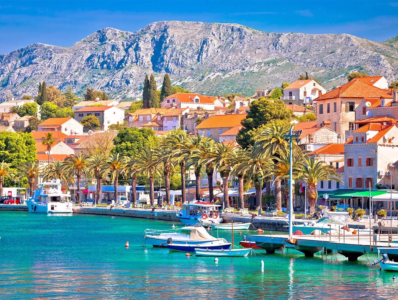 Panoramic view of Croatia's scenic Cavtat harbor, symbolizing the nation's shift to Fiscalization 2.0 with mandatory real-time e-invoicing and digital receipt reporting for VAT-registered businesses starting January 2026 by DDD Invoices 