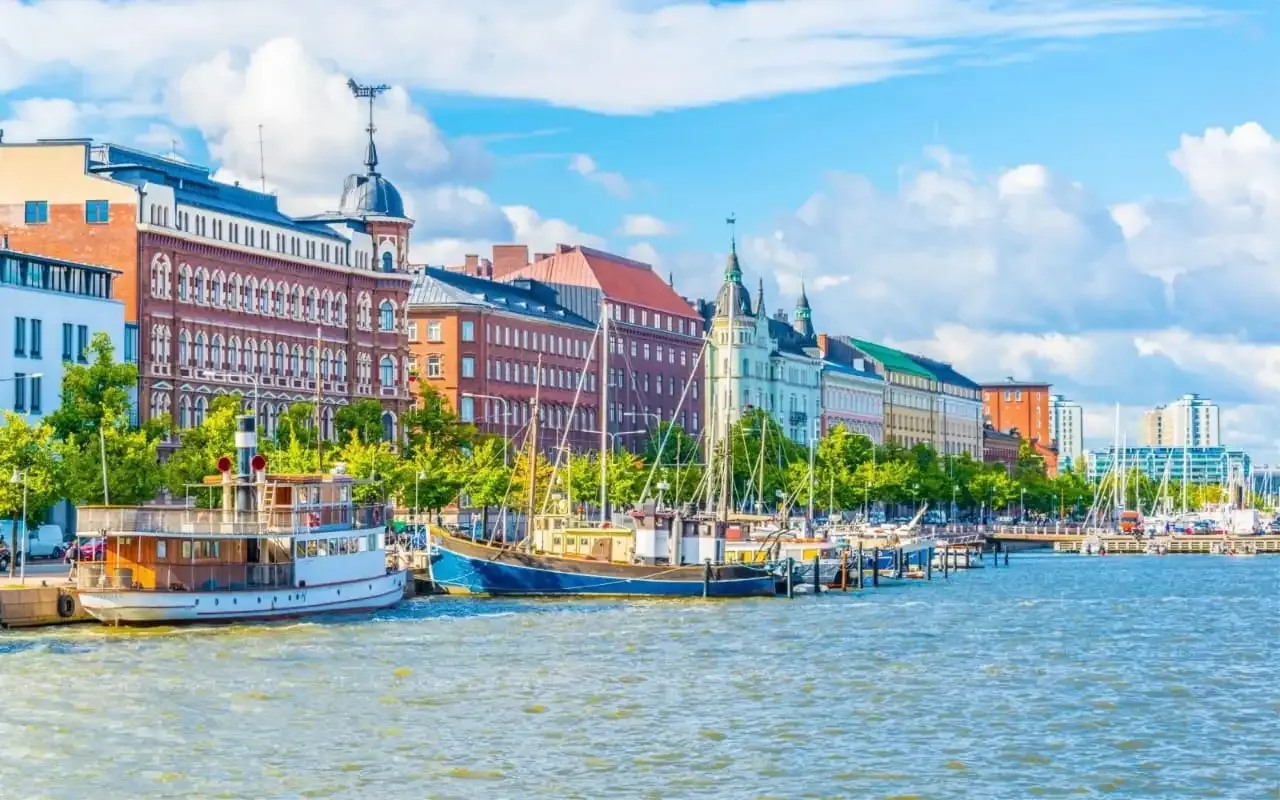 Helsinki cityscape at dusk, showing digital tax compliance for VAT-registered firms in Finland.