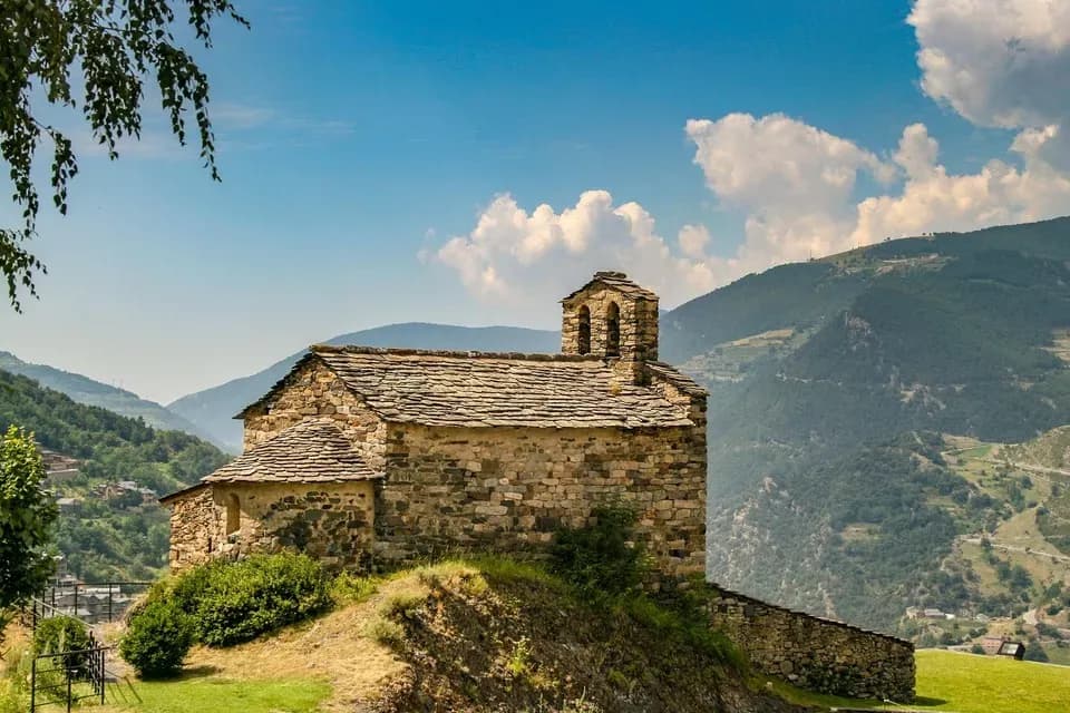 DDD Invoices-stone chapel in Andorra’s mountains with clear sky
