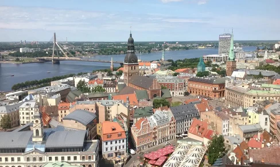 DDD Invoices supports fiscalisation in Latvia with a panoramic view of Riga’s historic buildings and riverfront skyline.