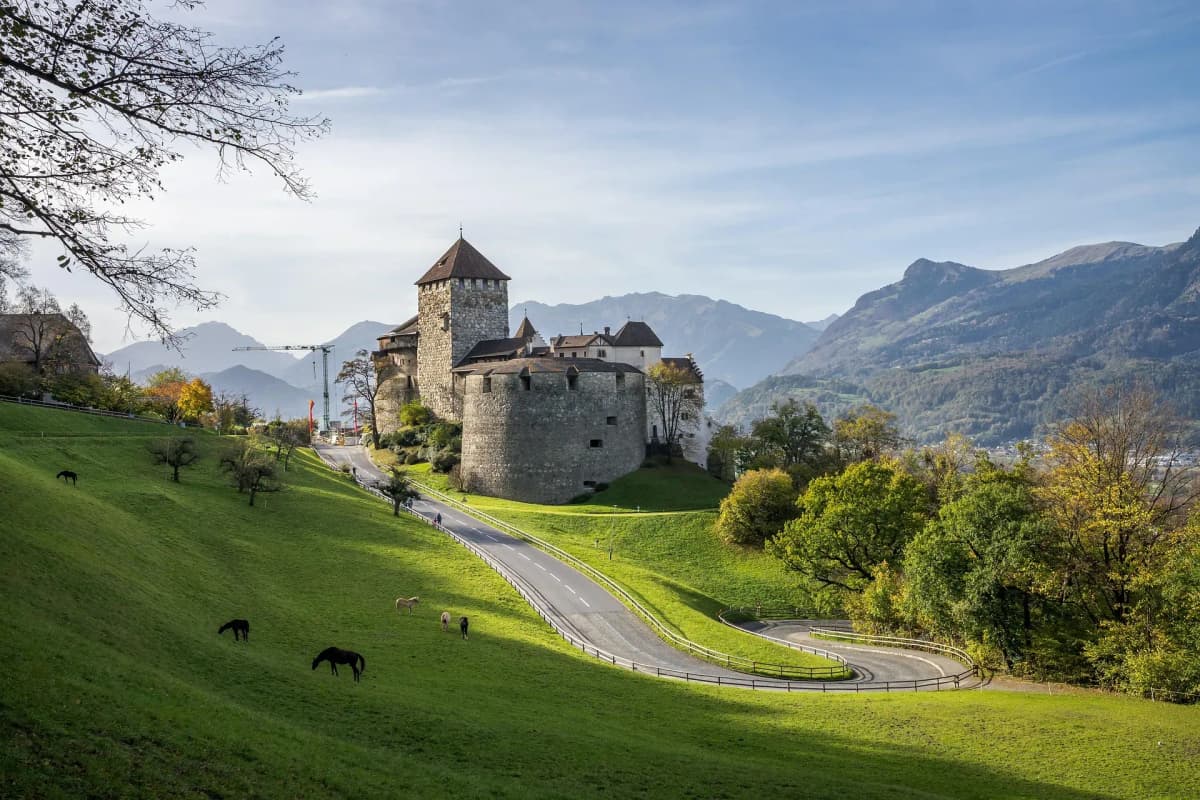 Fiscalization and real-time VAT compliance in Liechtenstein powered by DDD Invoices, featuring Balzers village and highlighting e-invoicing requirements