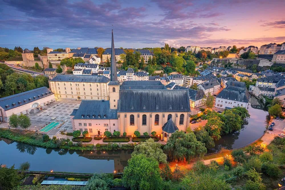 DDD Invoices supports fiscalisation in Luxembourg with evening views of the city and the Alzette River.