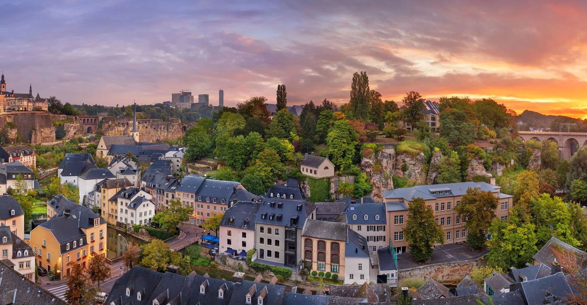 Sunrise over Luxembourg City, highlighting its historic fortifications and old-town charm where tradition meets digital progress with DDD Invoices driving e-invoicing transformation.