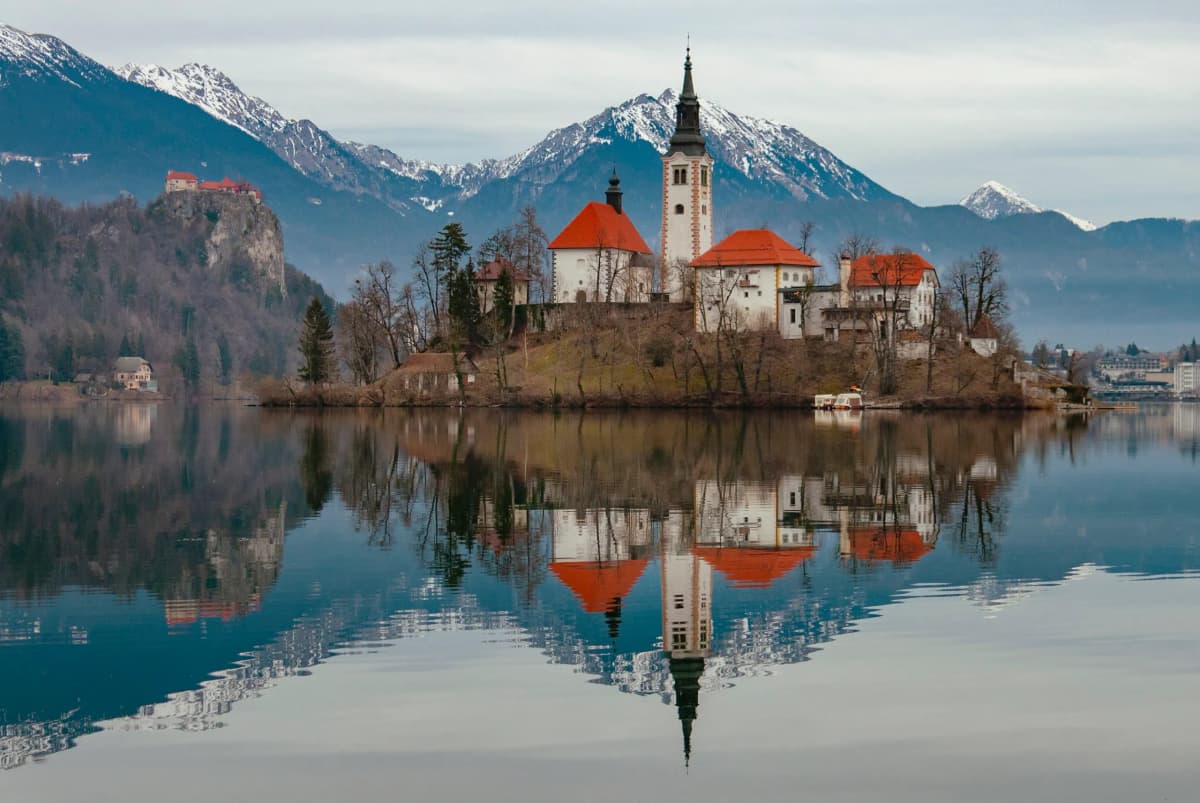 Slovenia fiscalization and e-invoicing by DDD Invoices, featuring Lake Bled with its iconic island church and alpine landscape, symbolizing compliant real-time VAT reporting and digital tax systems.