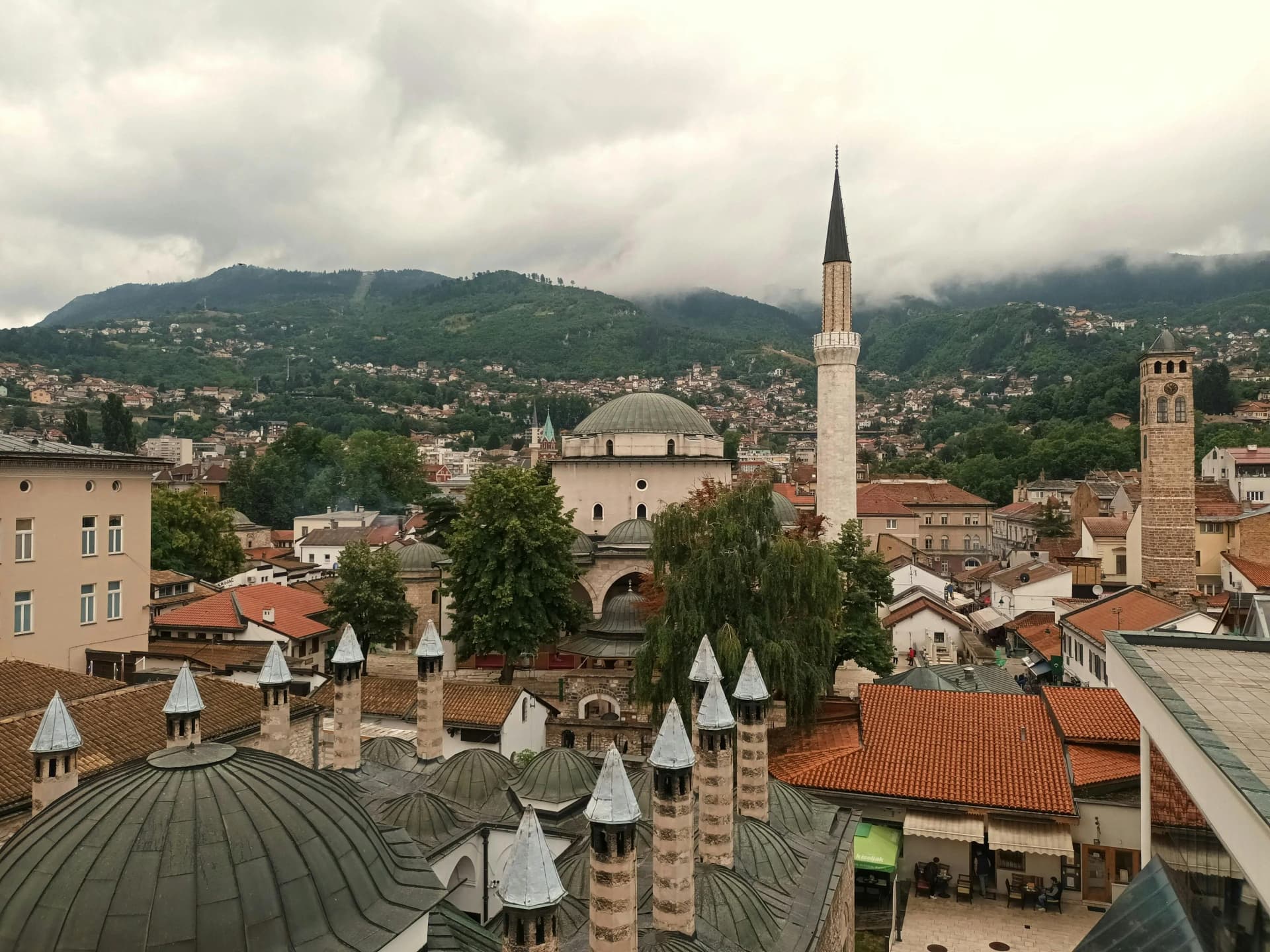 Bosnia's fiscalization rules and digital reporting obligations supported by DDD Invoices, represented by a scenic Bosnian city.