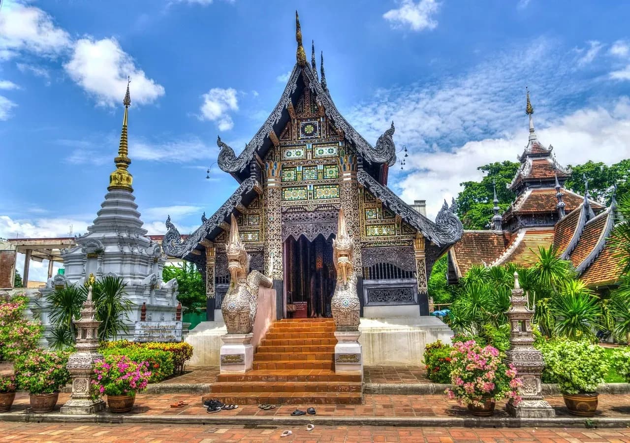  DDD Invoices fiscalization, VAT compliance, and e-invoicing solutions illustrated by the traditional Lanna-style Buddhist temple architecture in Chiang Mai, Thailand