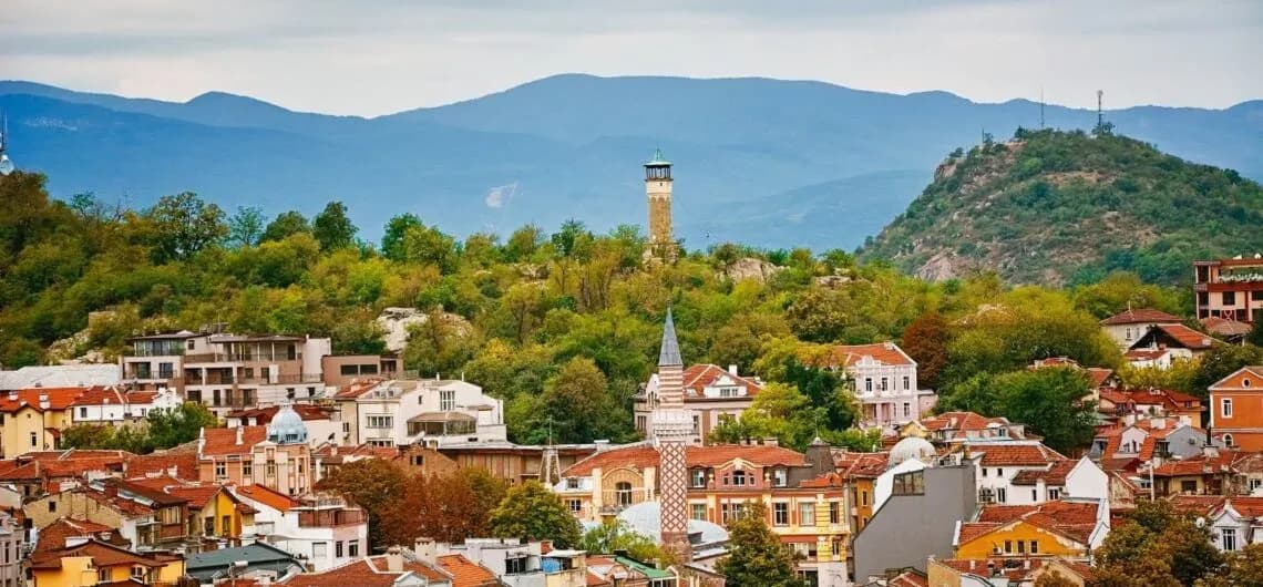 Historic cityscape in Bulgaria with red-roofed buildings and surrounding hills, reflecting the country’s e-invoicing environment supported by DDD Invoices.